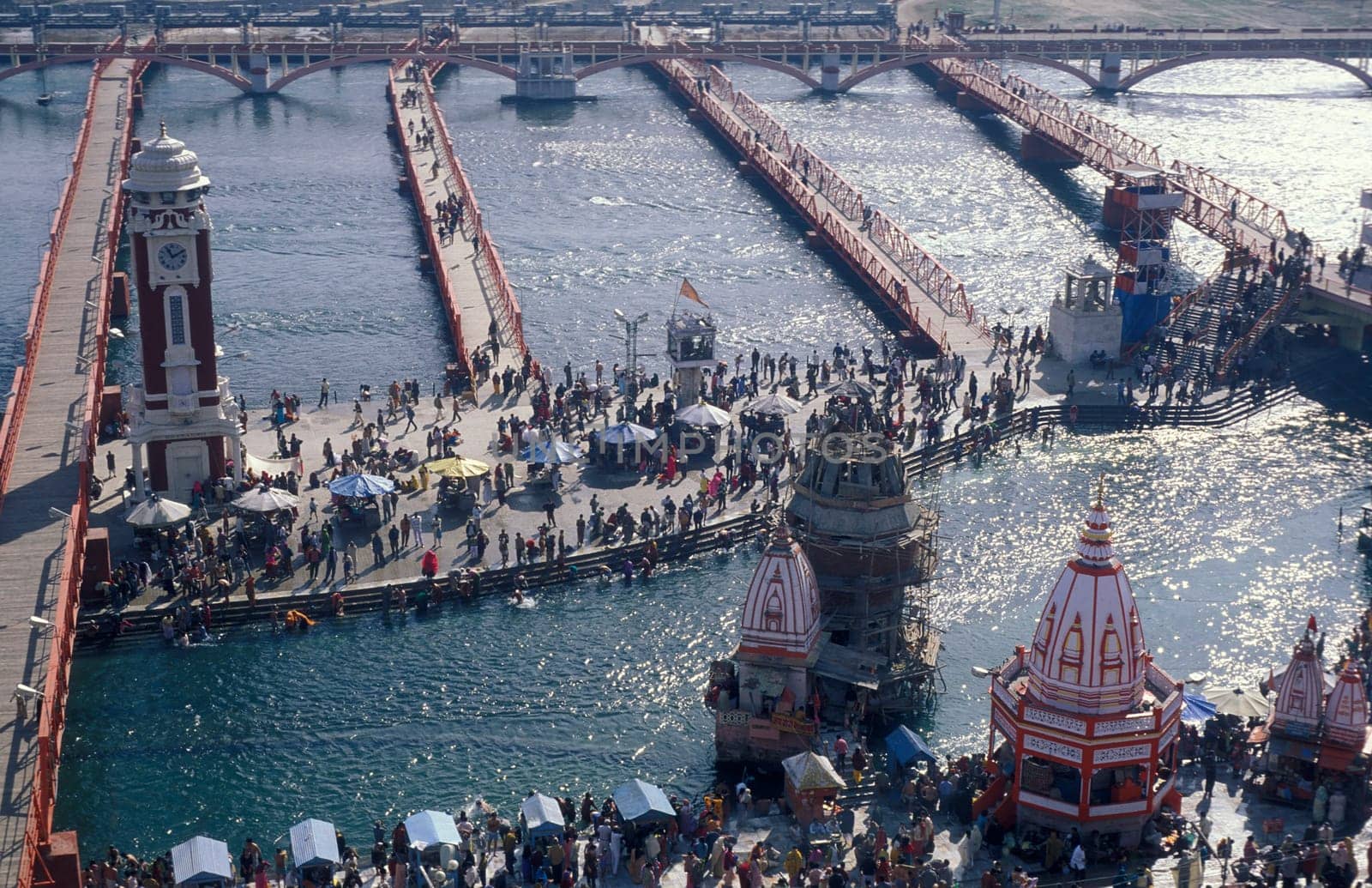 a view over public aerea with the Clock Tower at the Holy Ganges River in the city of Haridwar in the Province Uttarakhand in India.  India, Haridwar, February, 1998