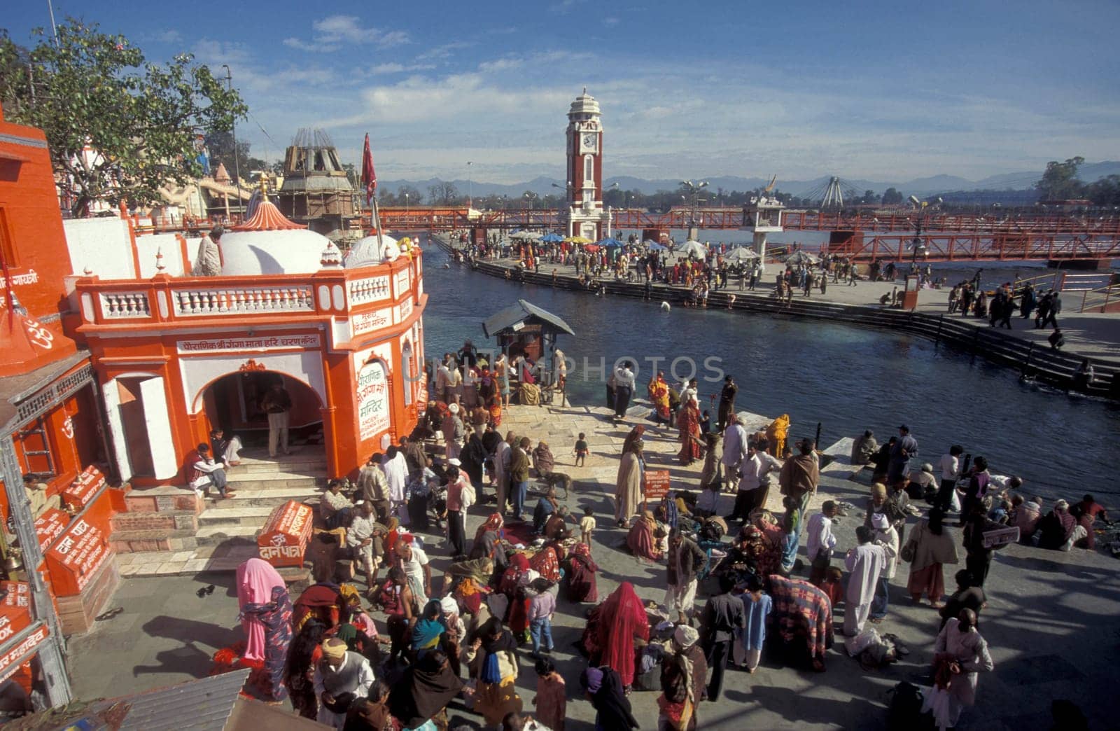 a view over public aerea with the Clock Tower at the Holy Ganges River in the city of Haridwar in the Province Uttarakhand in India.  India, Haridwar, February, 1998
