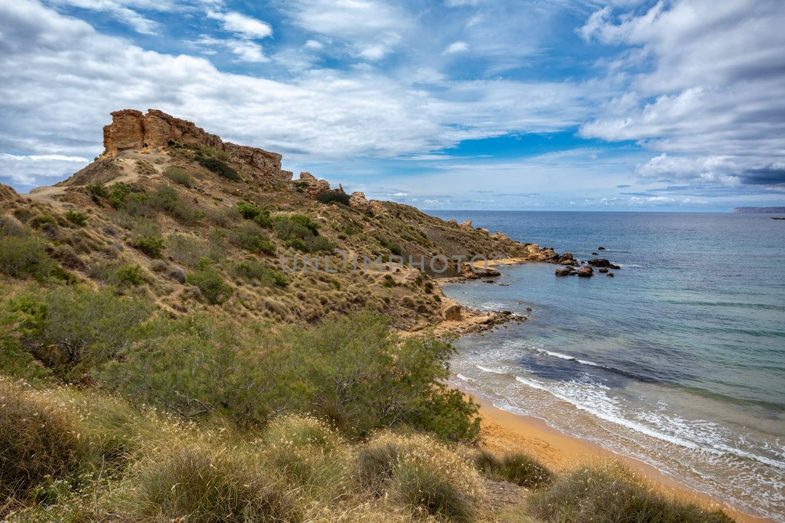Panoramic view over the Golden Bay and beach (Ghajn Tuffieha) with turquoise, azure sea, Malta travel destination.
