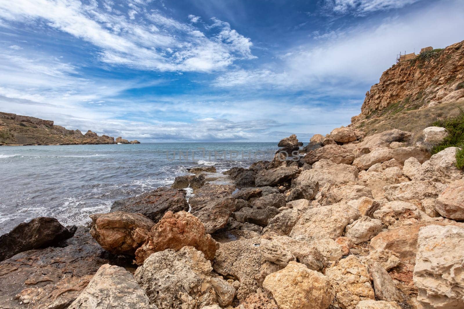 Panoramic view over the Golden Bay and beach (Ghajn Tuffieha) with turquoise, azure sea, Malta travel destination.