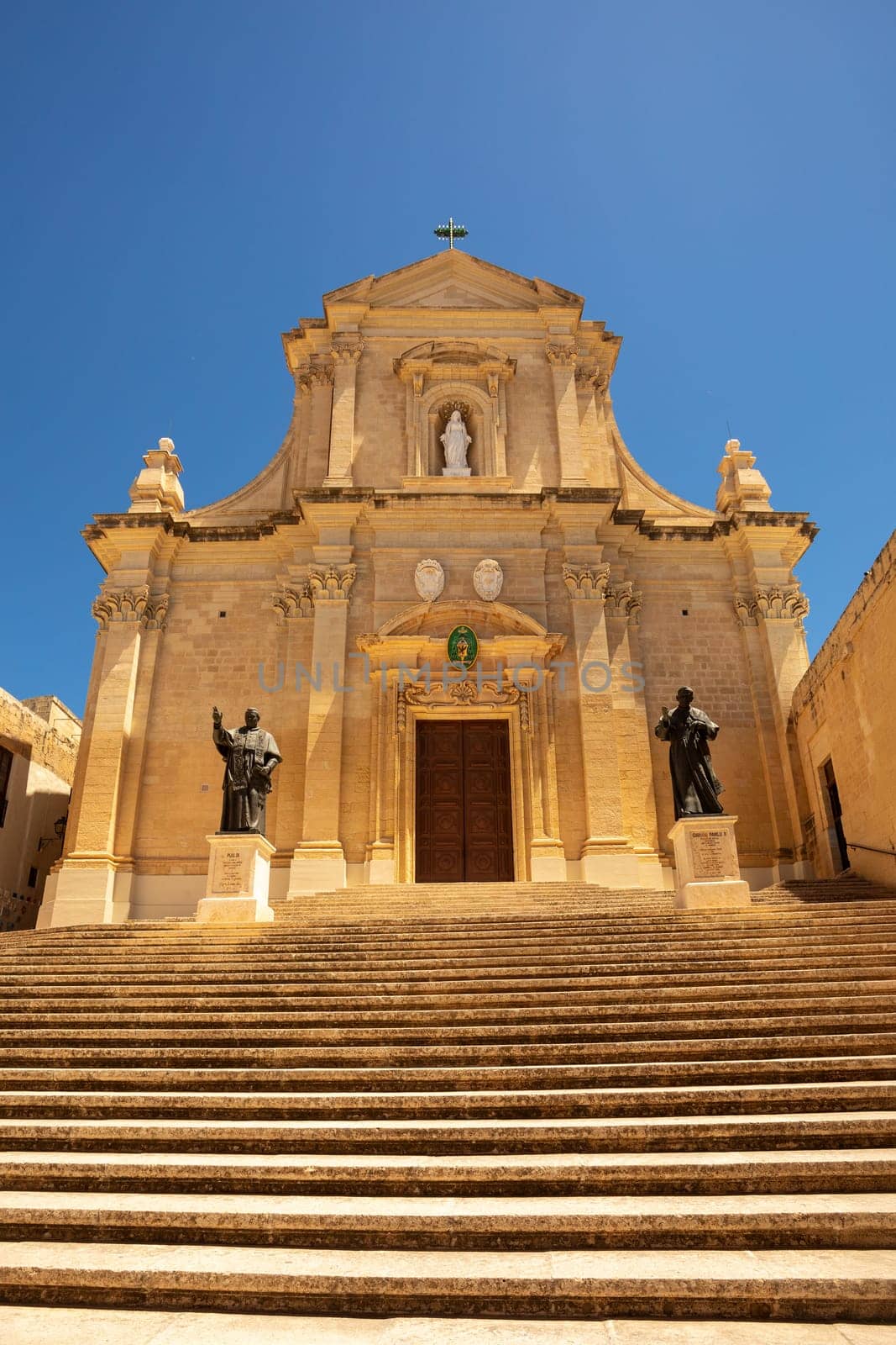 The imposing facade of Roman Catholic Assumption Cathedral looms over the Citadel of Victoria, a top tourist destination on Malta's Gozo island. Cultural heritage of Malta