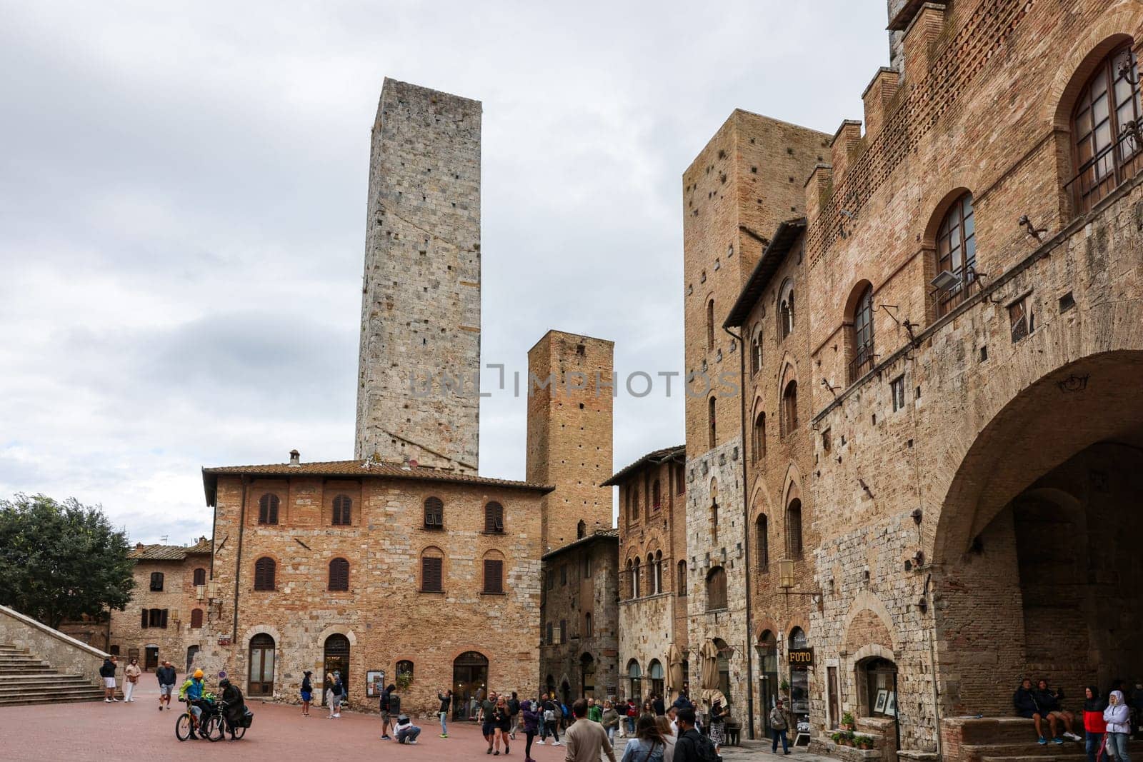 San Gimignano, Italy - Sept 17, 2022: Piazza della Cisterna in San Gimignano, Tuscany, Italy