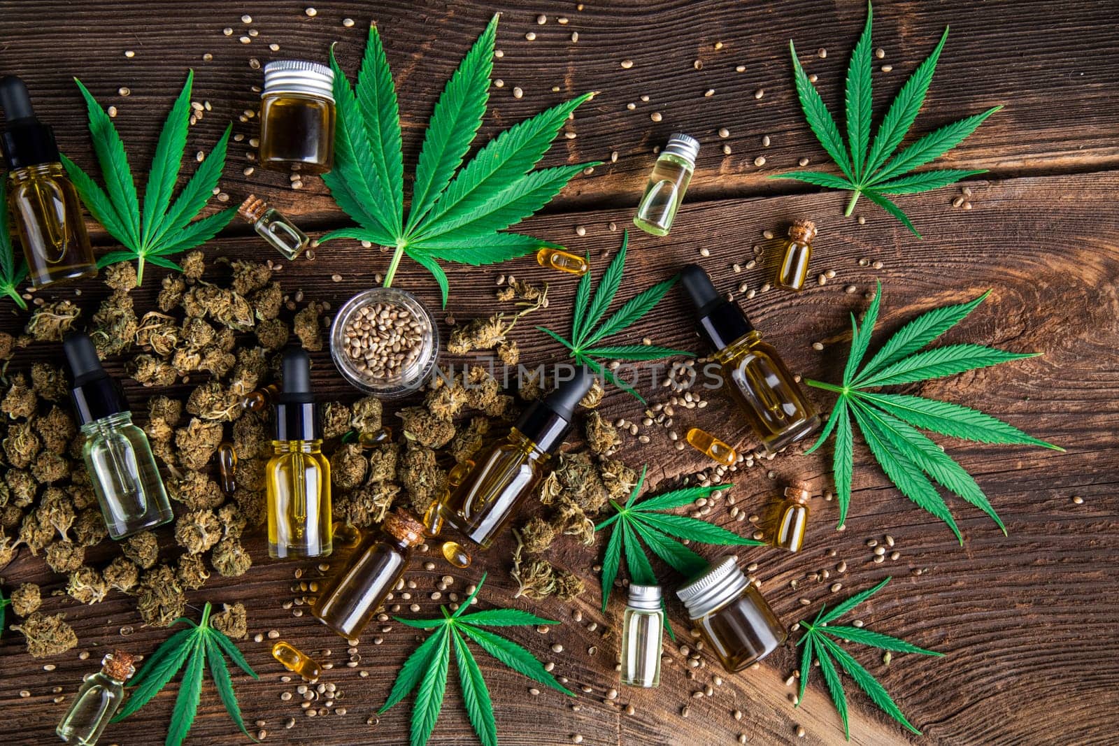 Hemp oil and marijuana leaves on extract cbd
