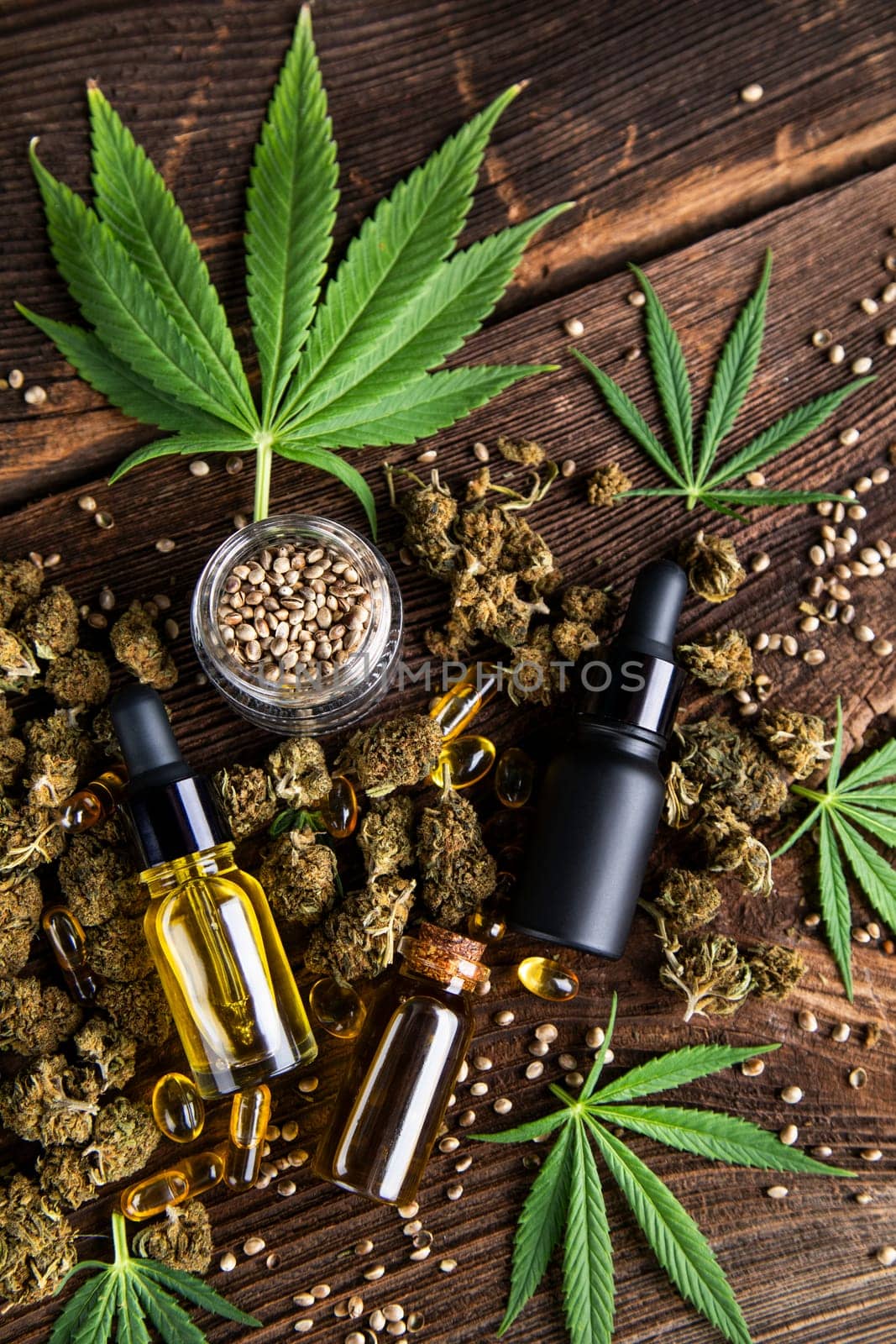Hemp oil and marijuana leaves on extract cbd