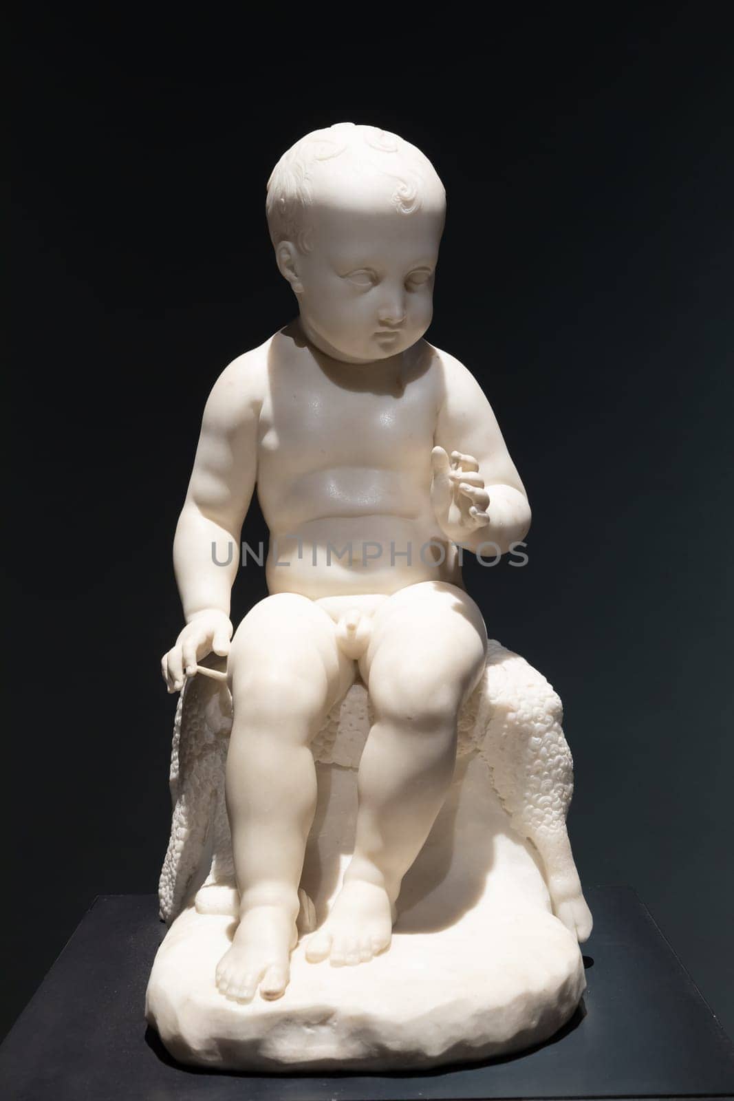 Bassano del Grappa, Italy - 22 December 2023. The Infant St John the Baptis, by sculptor Antonio Canova, 1822, marble