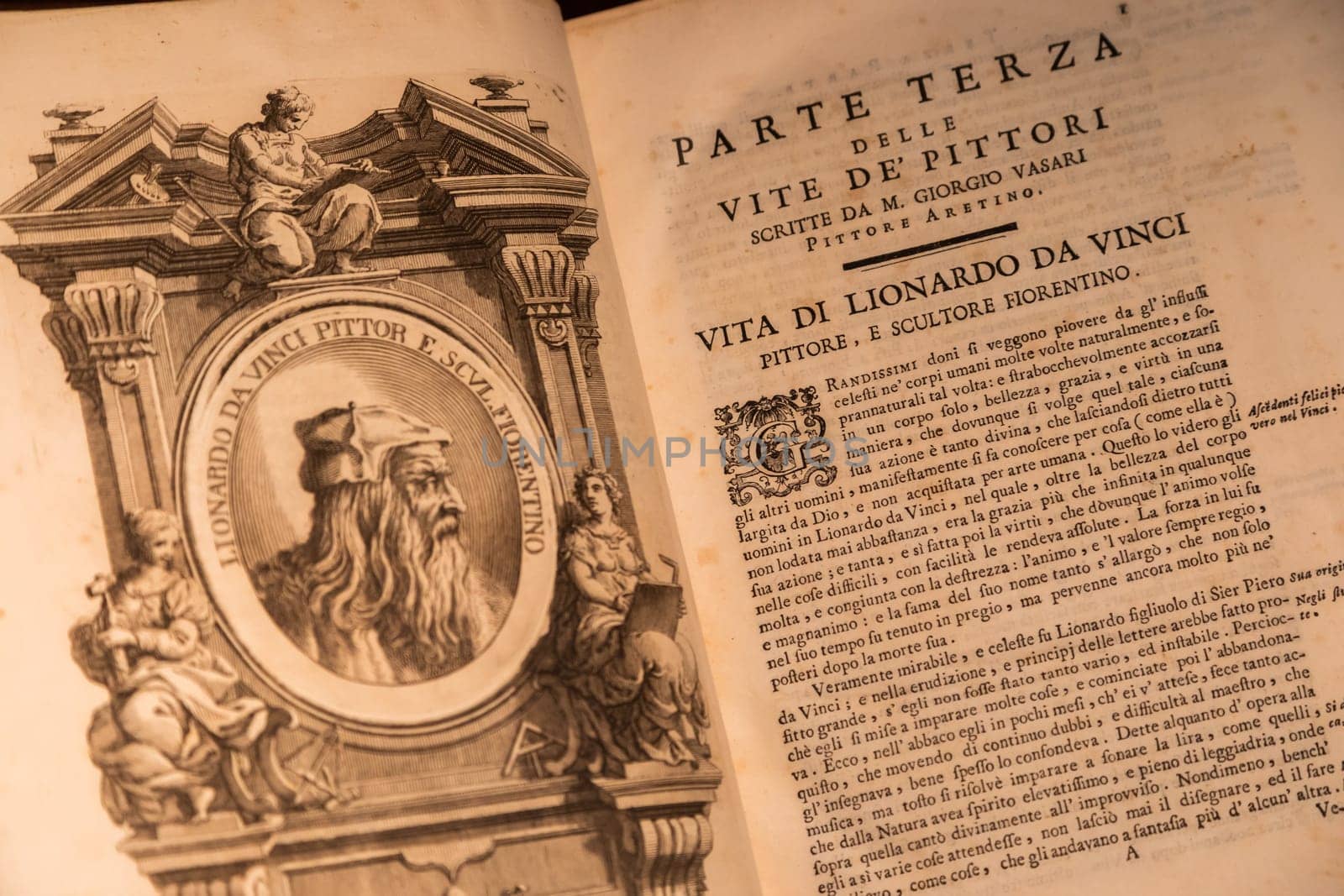 Turin, Italy - 22 August 2023. Royal Museum. Detail of Giorgio Vasari book - Le Vite, 1550. Page with Leonardo da Vinci portrait