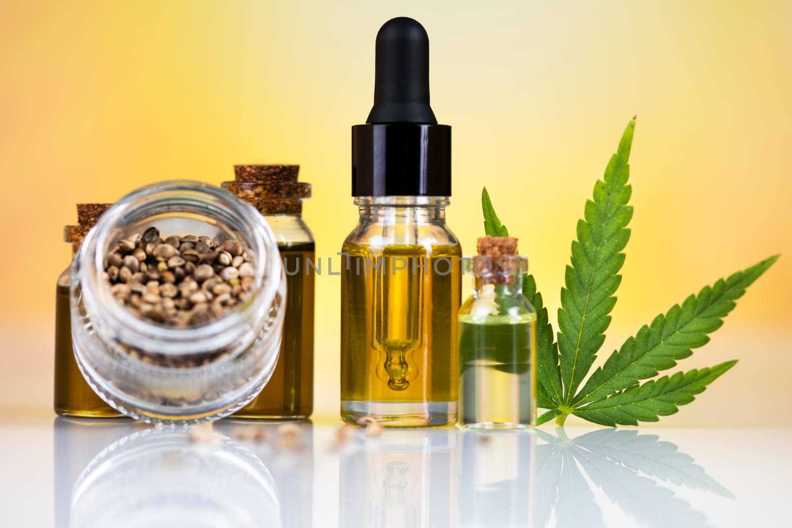 Hemp oil and marijuana leaves on extract cbd