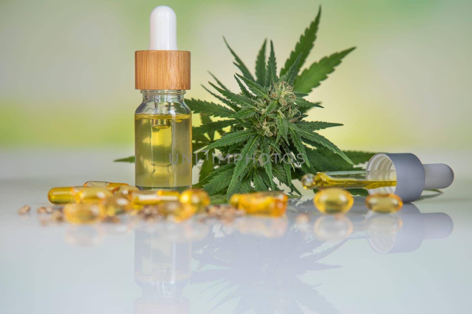 Bottles with hemp oil and cannabis leaves, marijuana