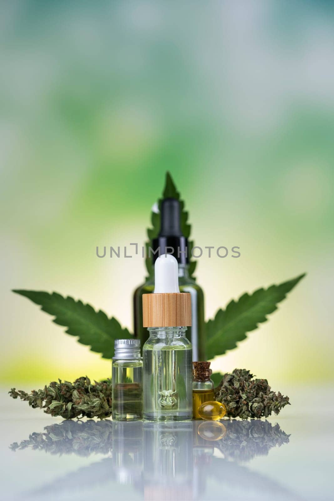 Hemp cbd oil, cannabis leaves, hemp seeds and bottles of oil