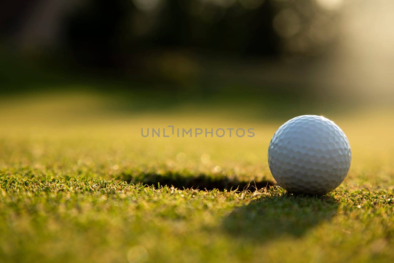 Golf ball, course on a sunny day