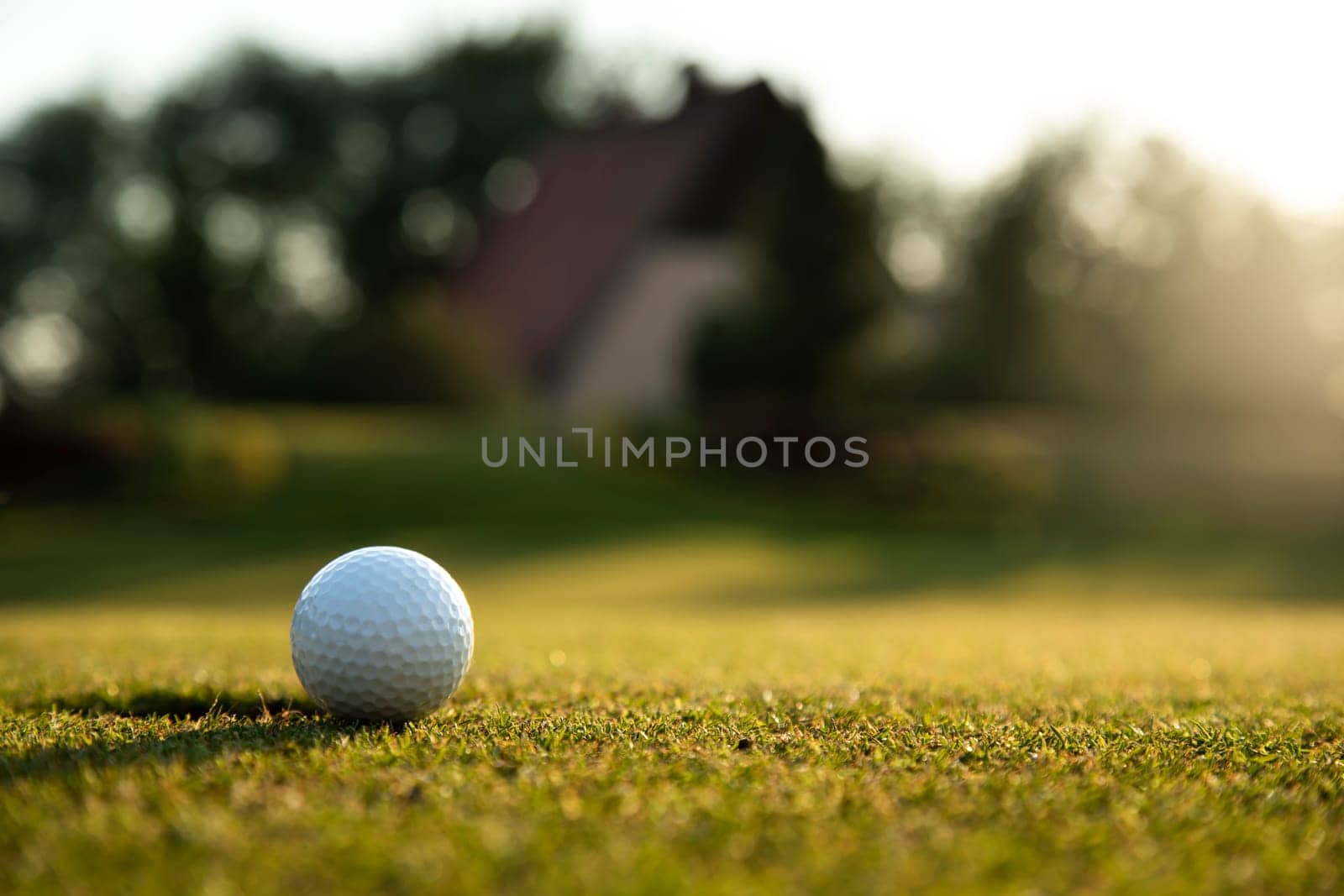 Golf ball, course on a sunny day