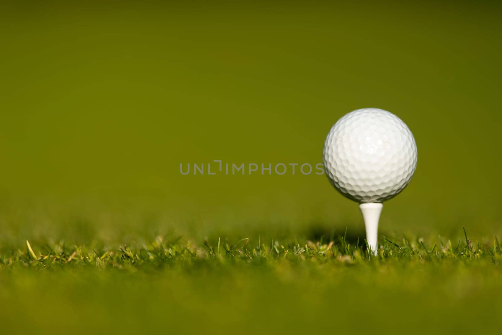 Golf course with ball and grass