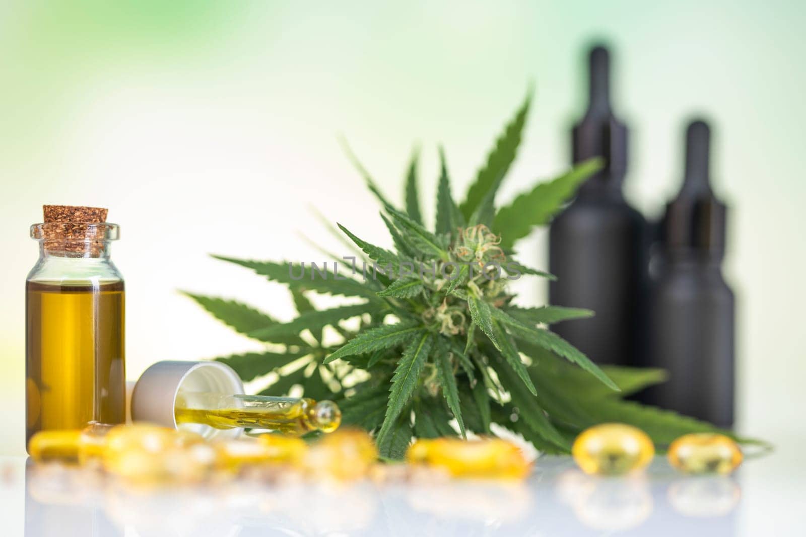 Bottles with hemp oil and cannabis leaves, marijuana