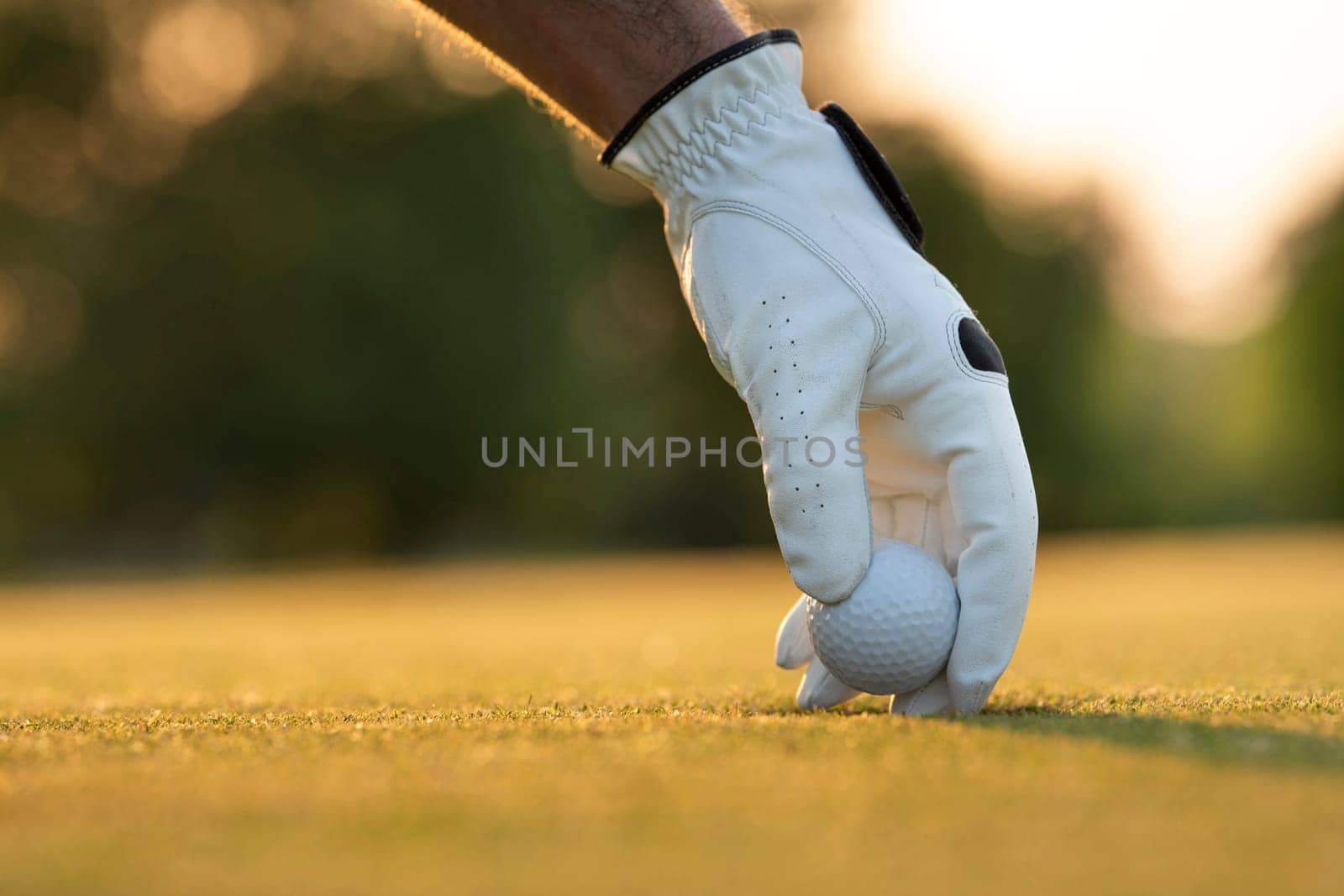 Golf player playing in a golf club on close up of a hand