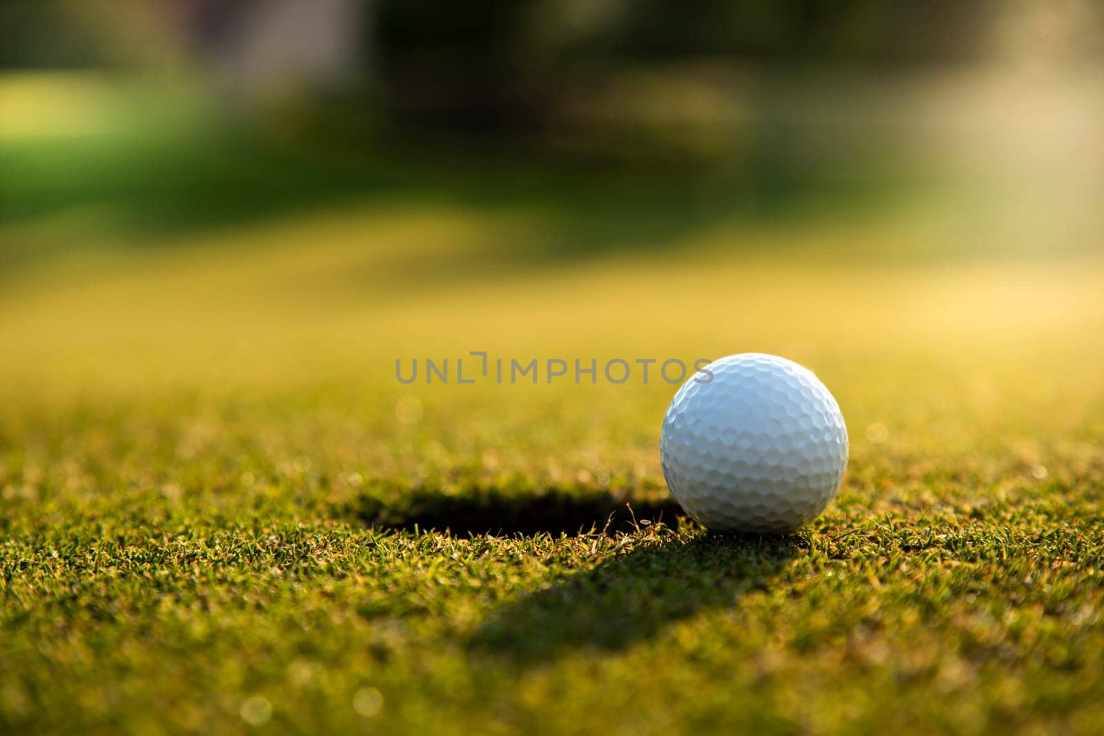 Golf ball, course on a sunny day