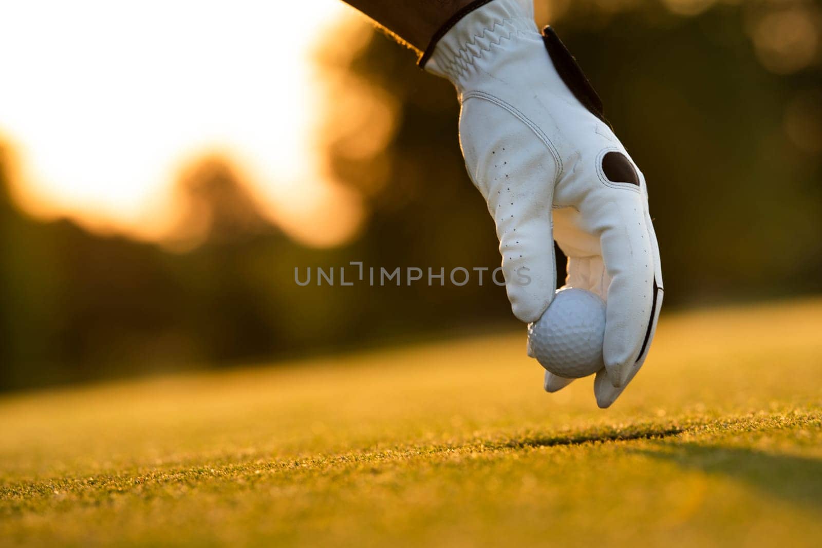 Golf player playing in a golf club on close up of a hand