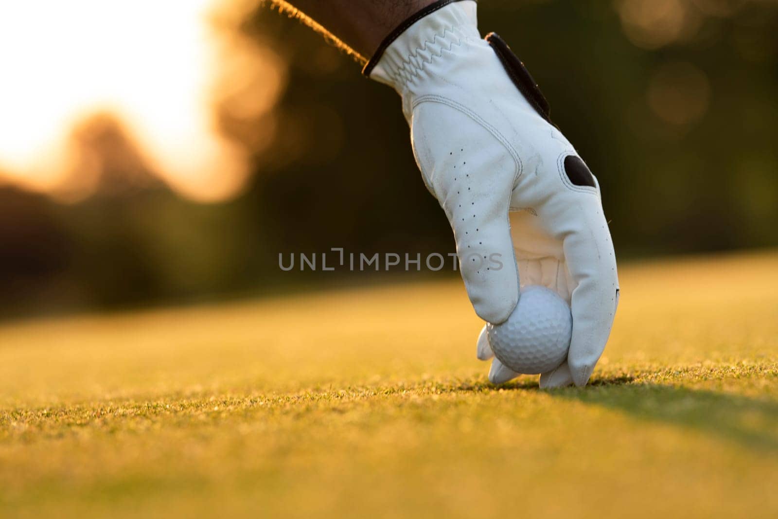 Golf player playing in a golf club on close up of a hand