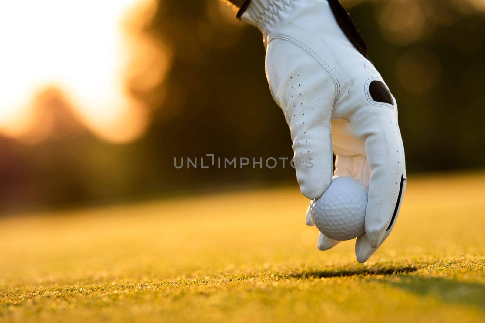 Golf player playing in a golf club on close up of a hand