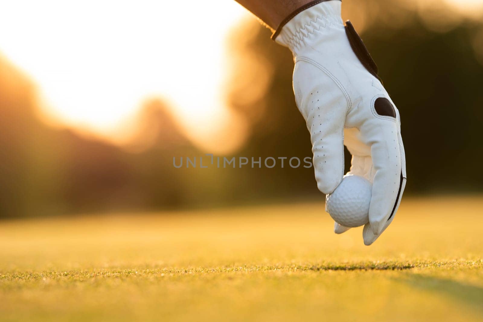 Golf player playing in a golf club on close up of a hand