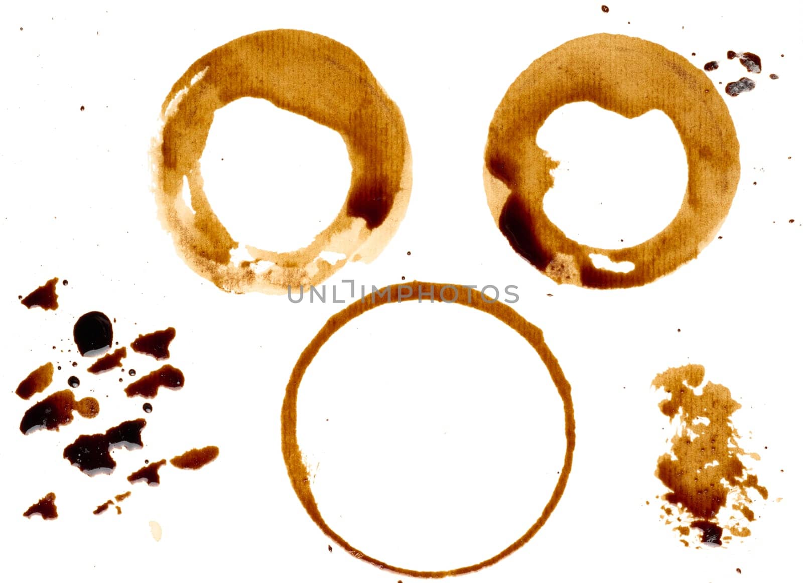 Spilled coffee with drops and splashes, round imprints from a cup on an isolated background, set