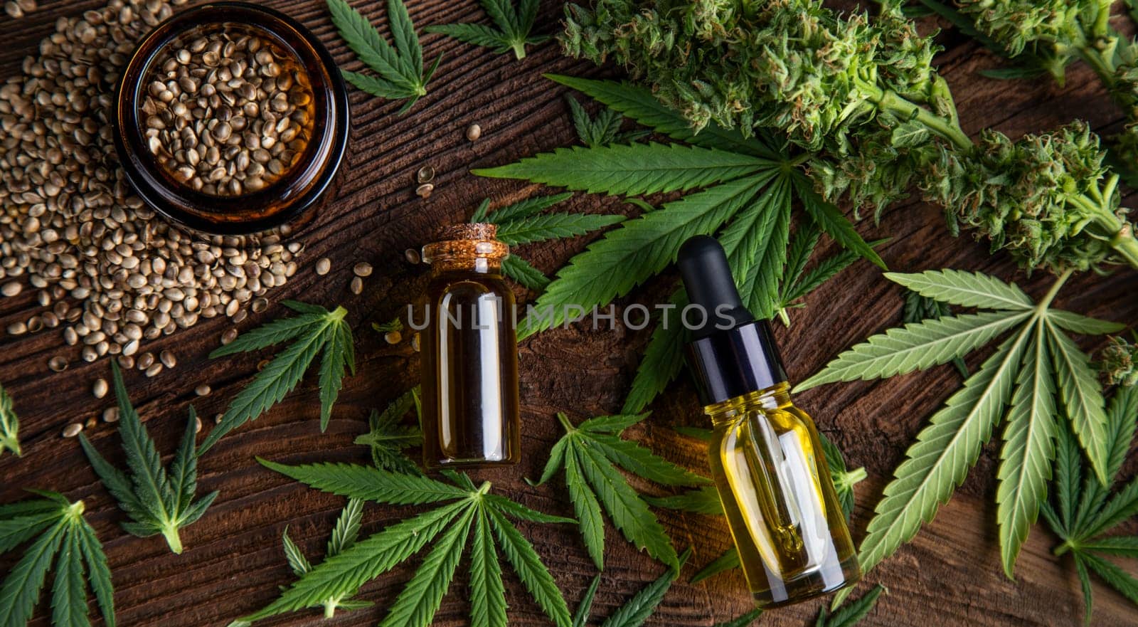 Cbd oil and marijuana plant, hemp seeds, medical marijuana concept