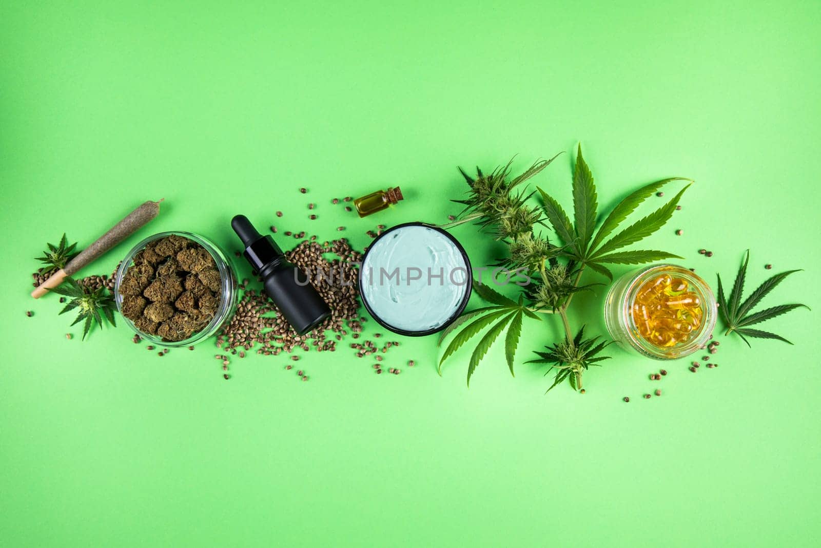 Marijuana buds with cannabis leaves on cbd concept