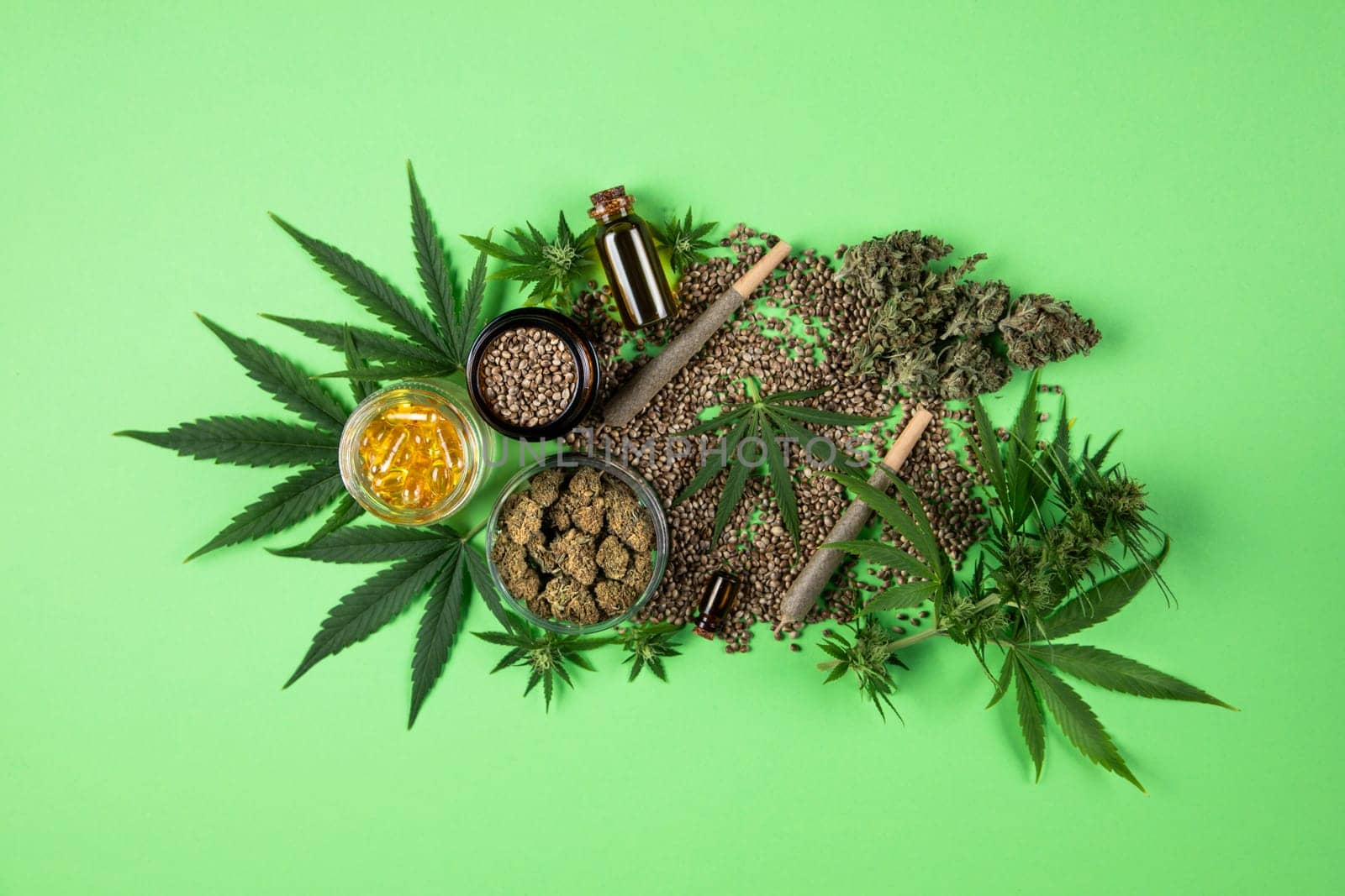 Marijuana buds with cannabis leaves on cbd concept