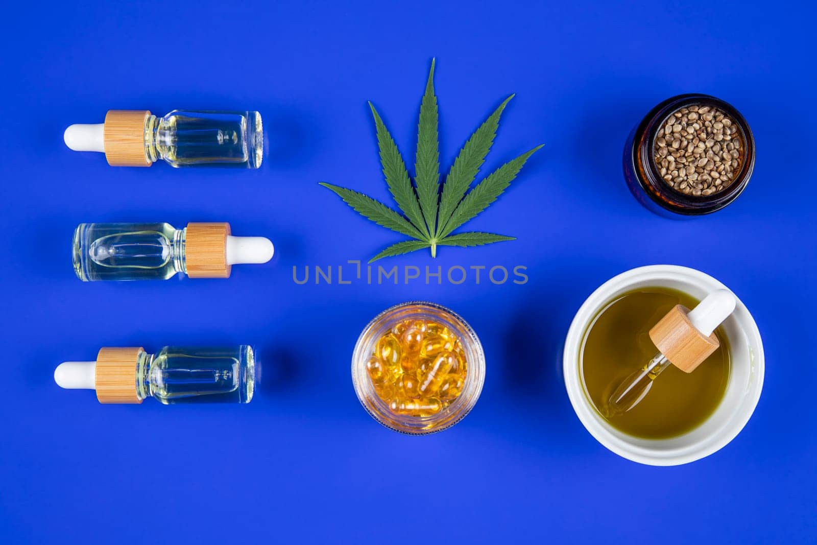Marijuana buds with cannabis leaves on cbd concept