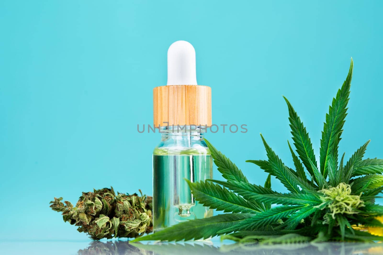 Hemp oil and marijuana leaves on extract cbd