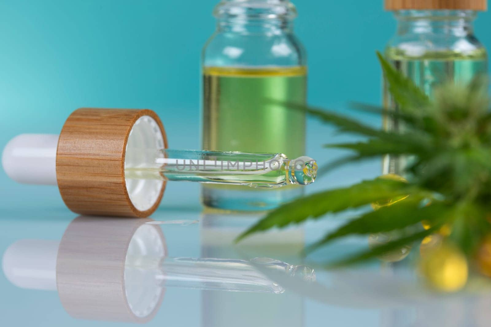 Set of essential oil cbd in a glass bottle, with a pipette, marijuana concept