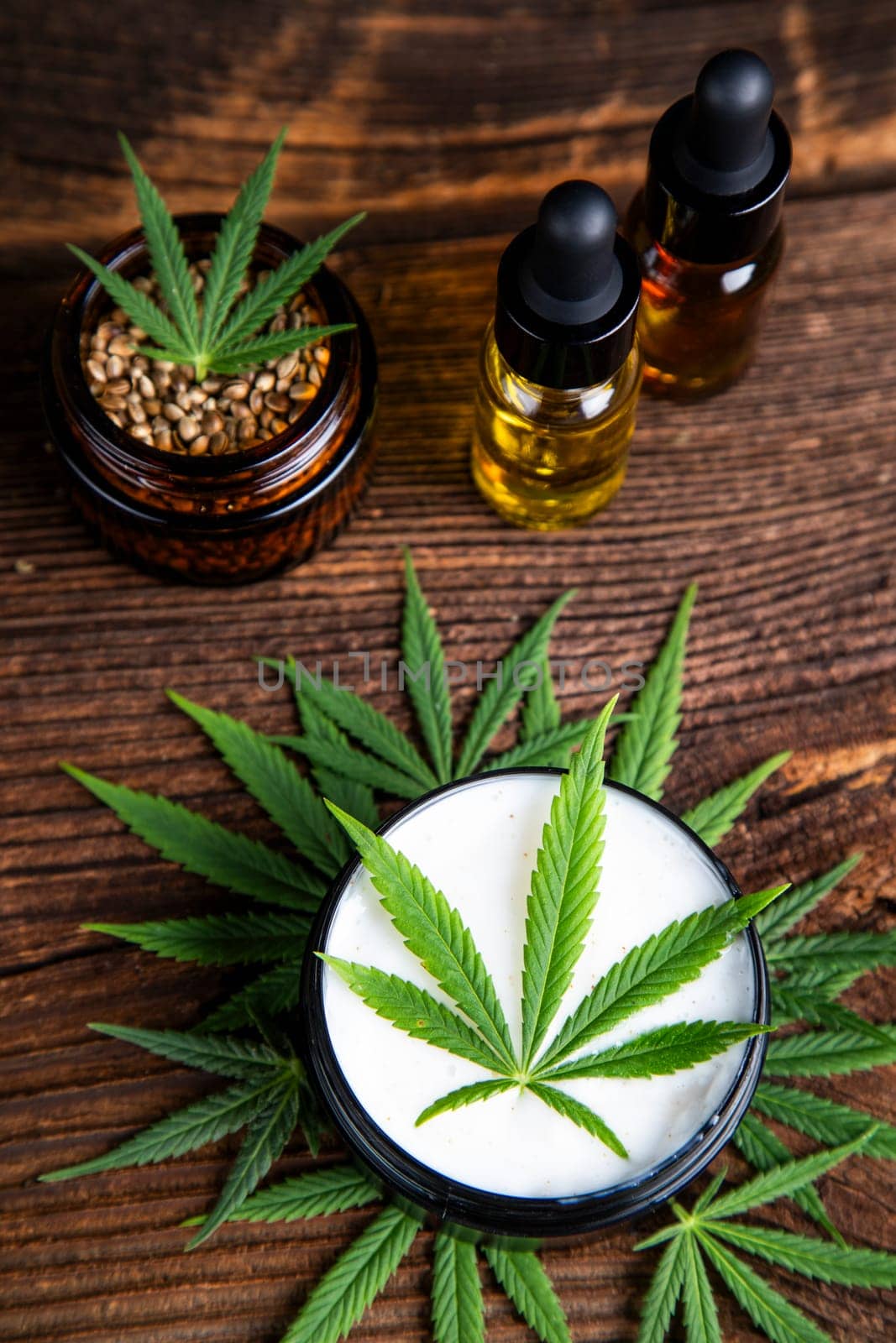 Cbd hemp cosmetics, oil in bottle and marijuana