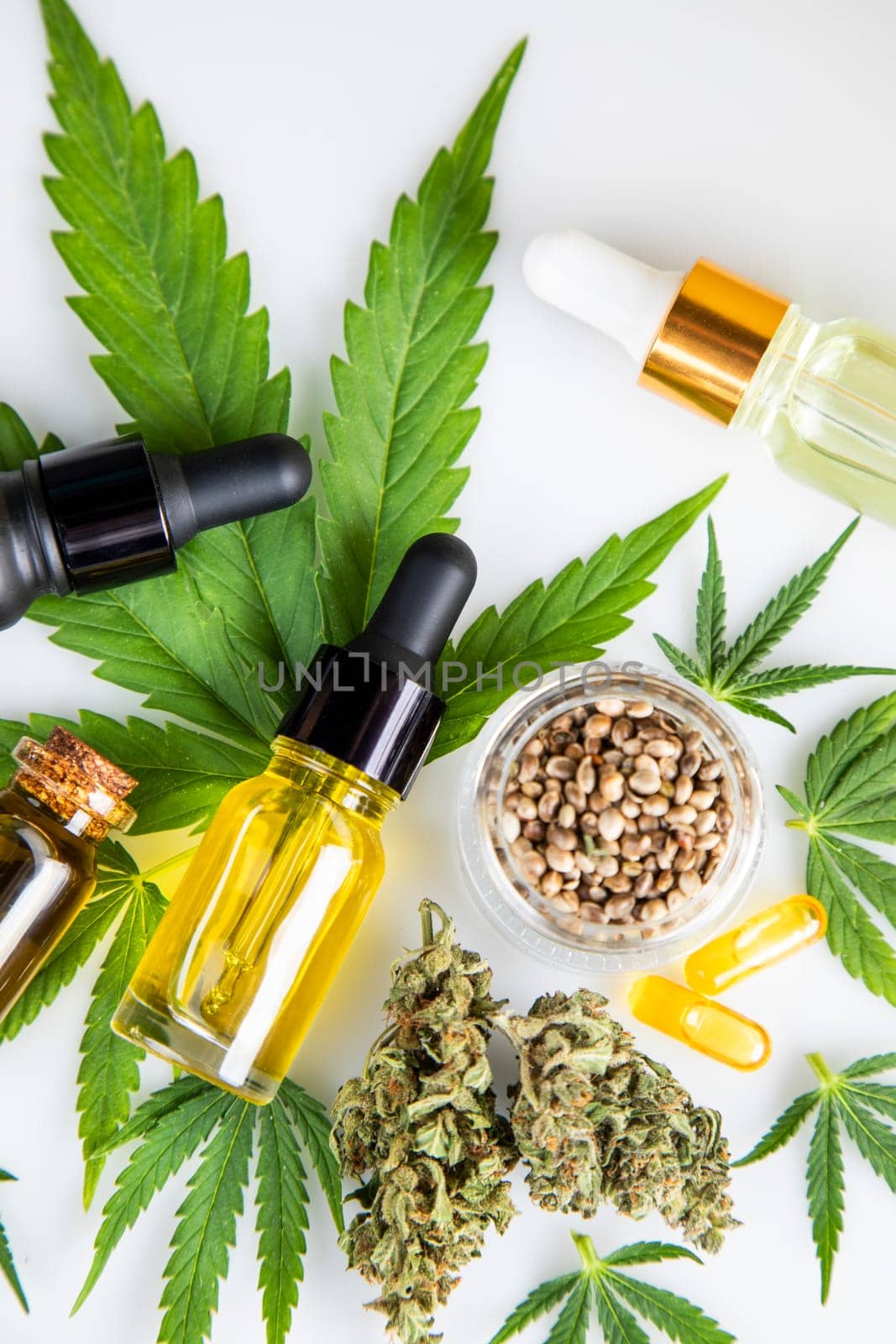 Bottles with hemp oil and cannabis leaves, marijuana