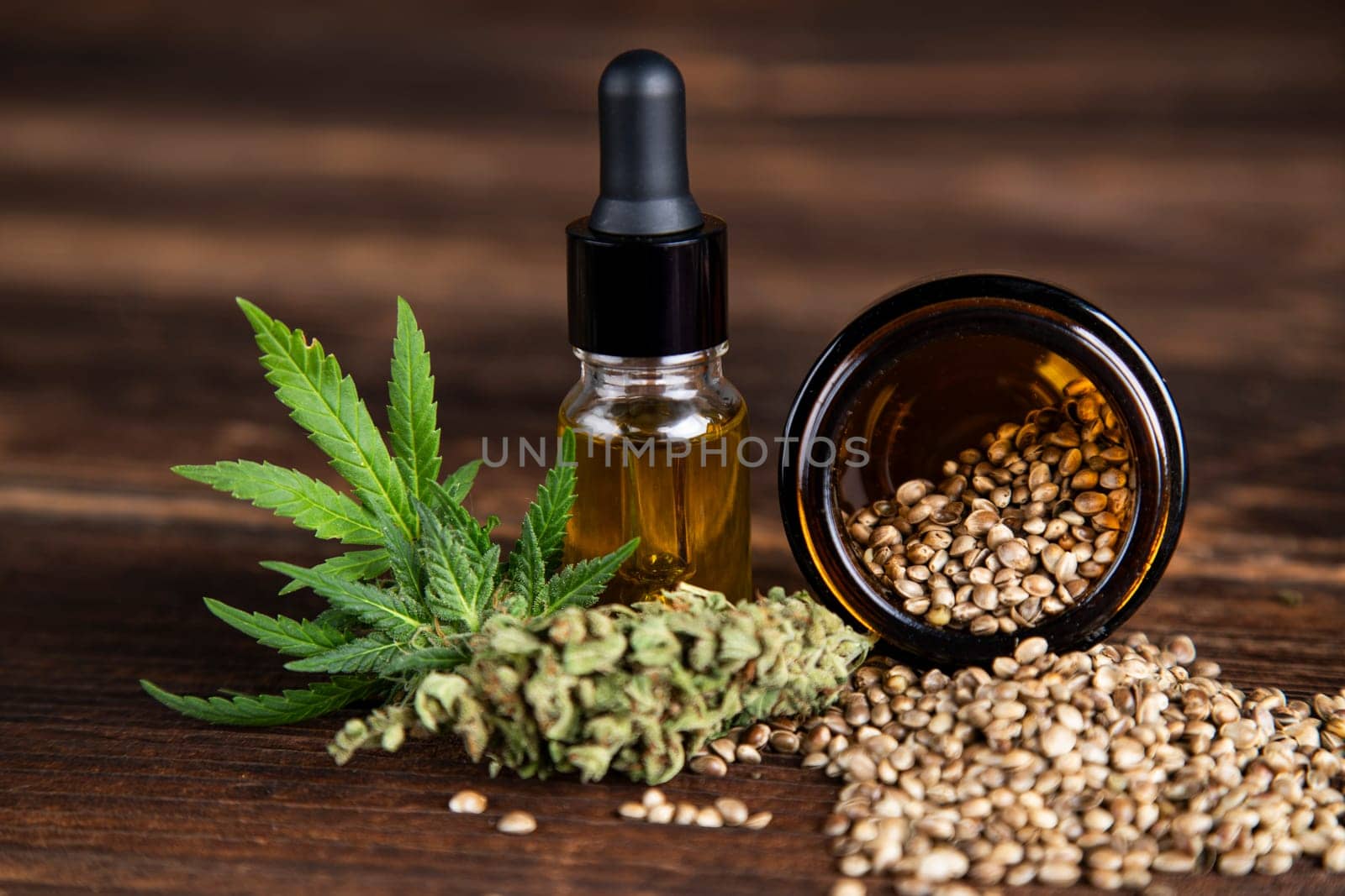 Hemp oil and marijuana leaves on extract cbd