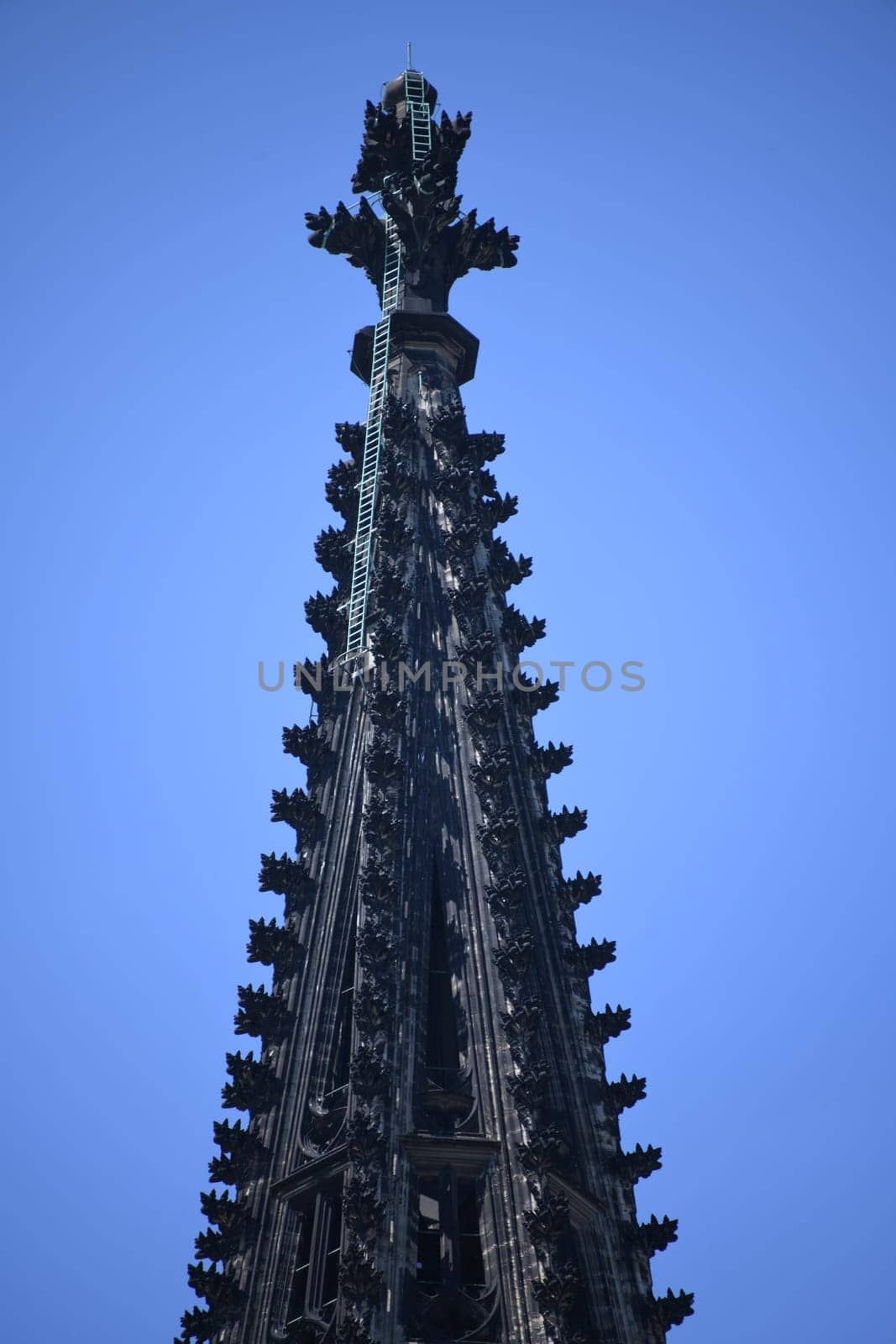Cologne Cathedral is the third highest church in the world. The cathedral in the Archdiocese of Cologne is built in the Gothic style. World Heritage Site and tourist attraction. Steeple,finial and ladder.
