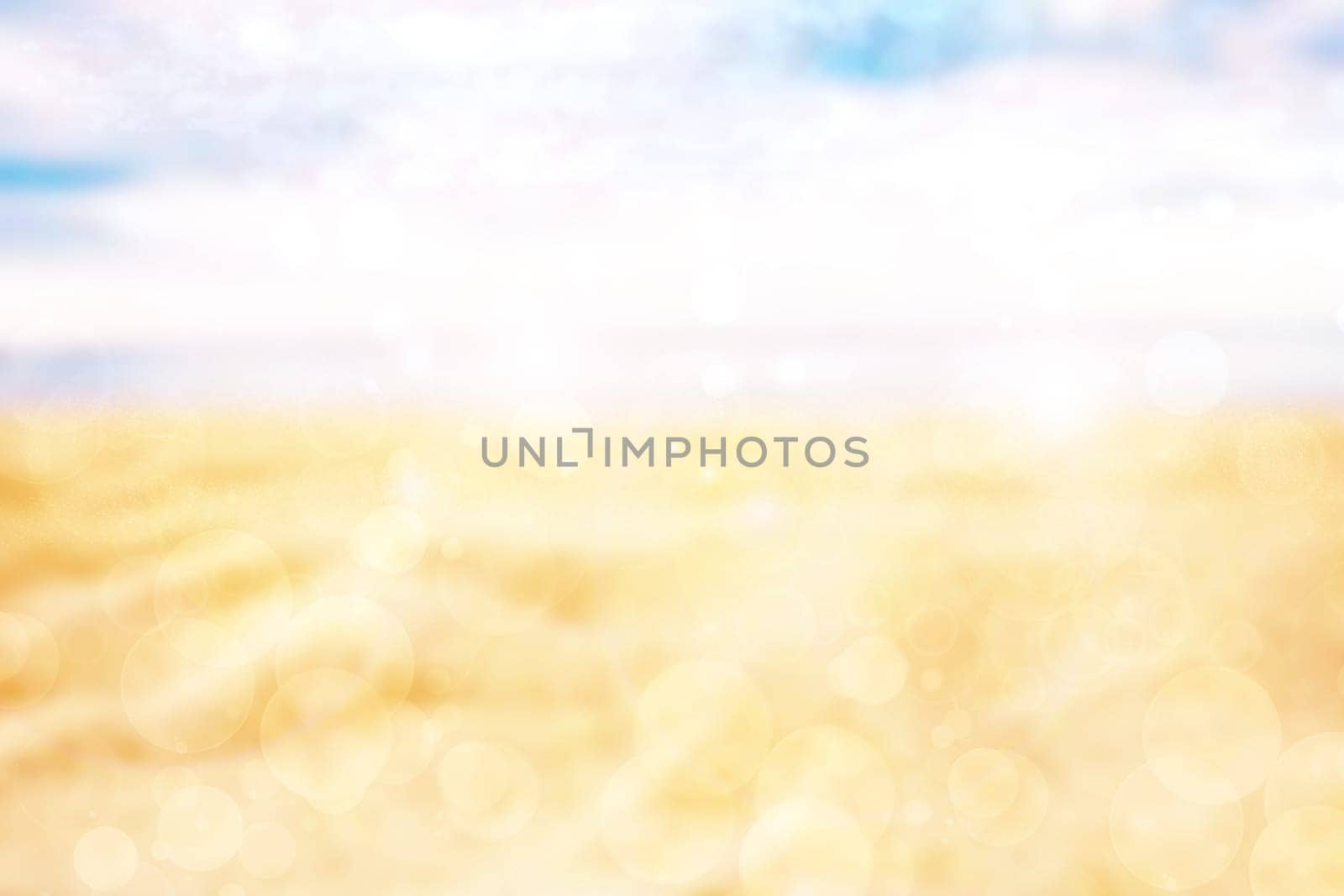 Abstract desert landscape background with yellow sand dust and a glistening sun with blue turquoise sky and bokeh circles. Beautiful texture. Travel and tourism advertisement.
