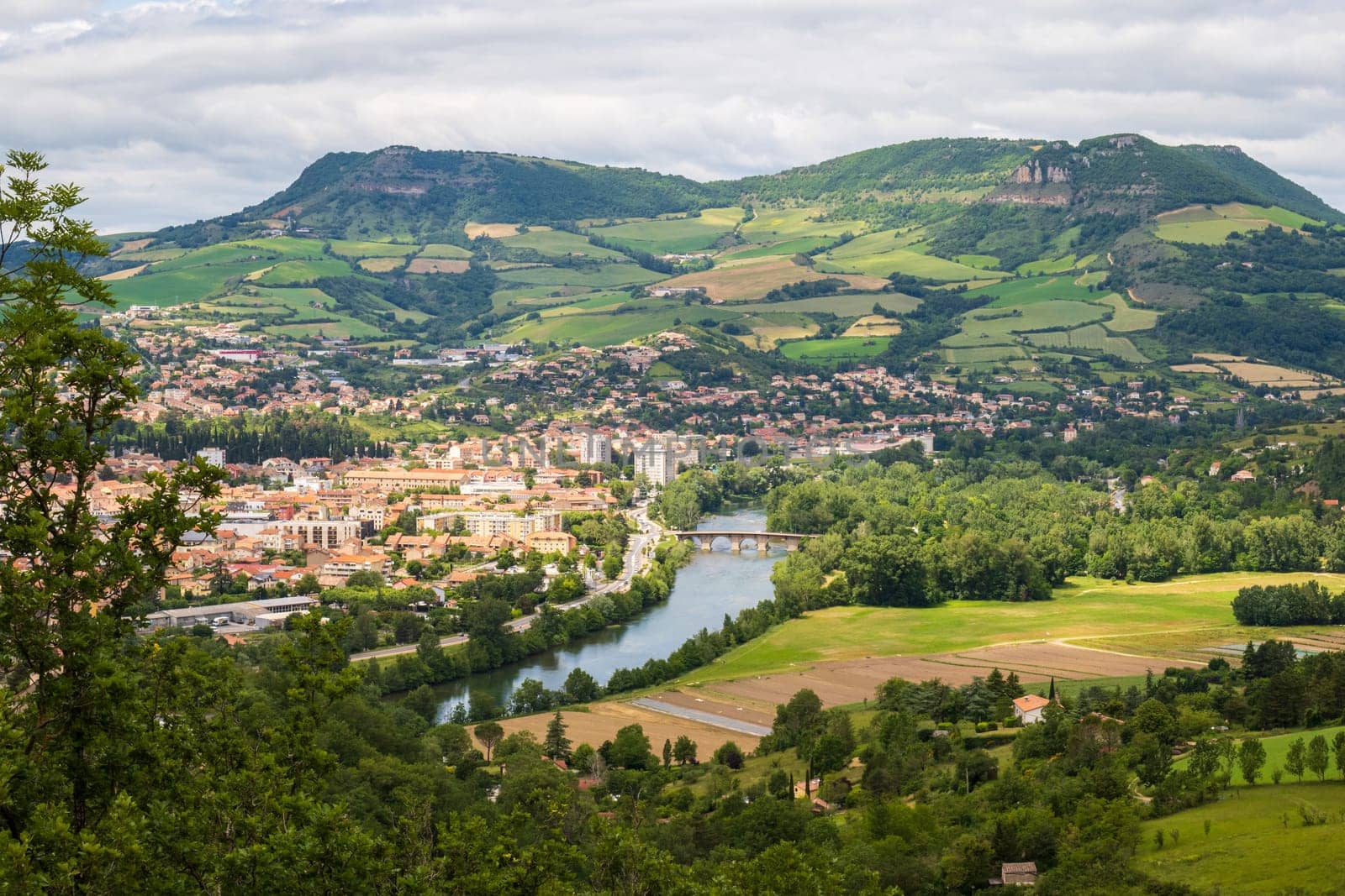 View over Millau town with Causse du Larzac limestone plateau, listed as UNESCO World Heritage Site. Department of Aveyron, France