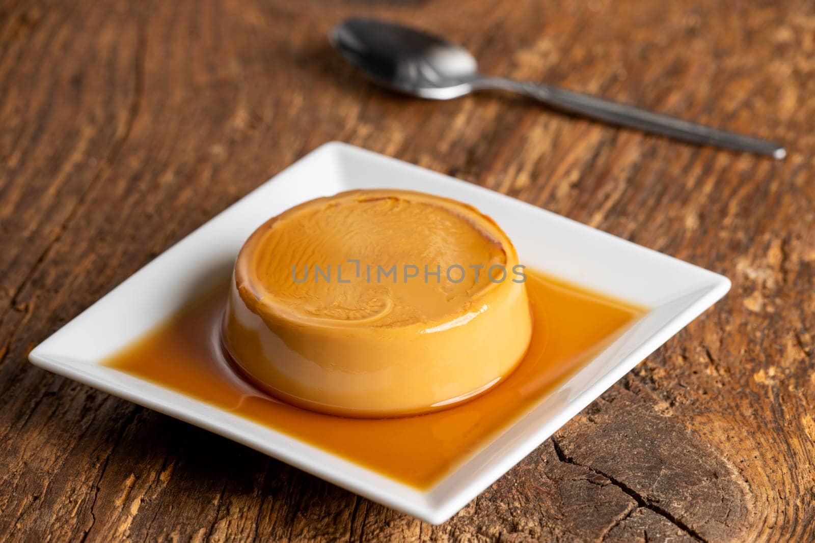 french flan on dark wood