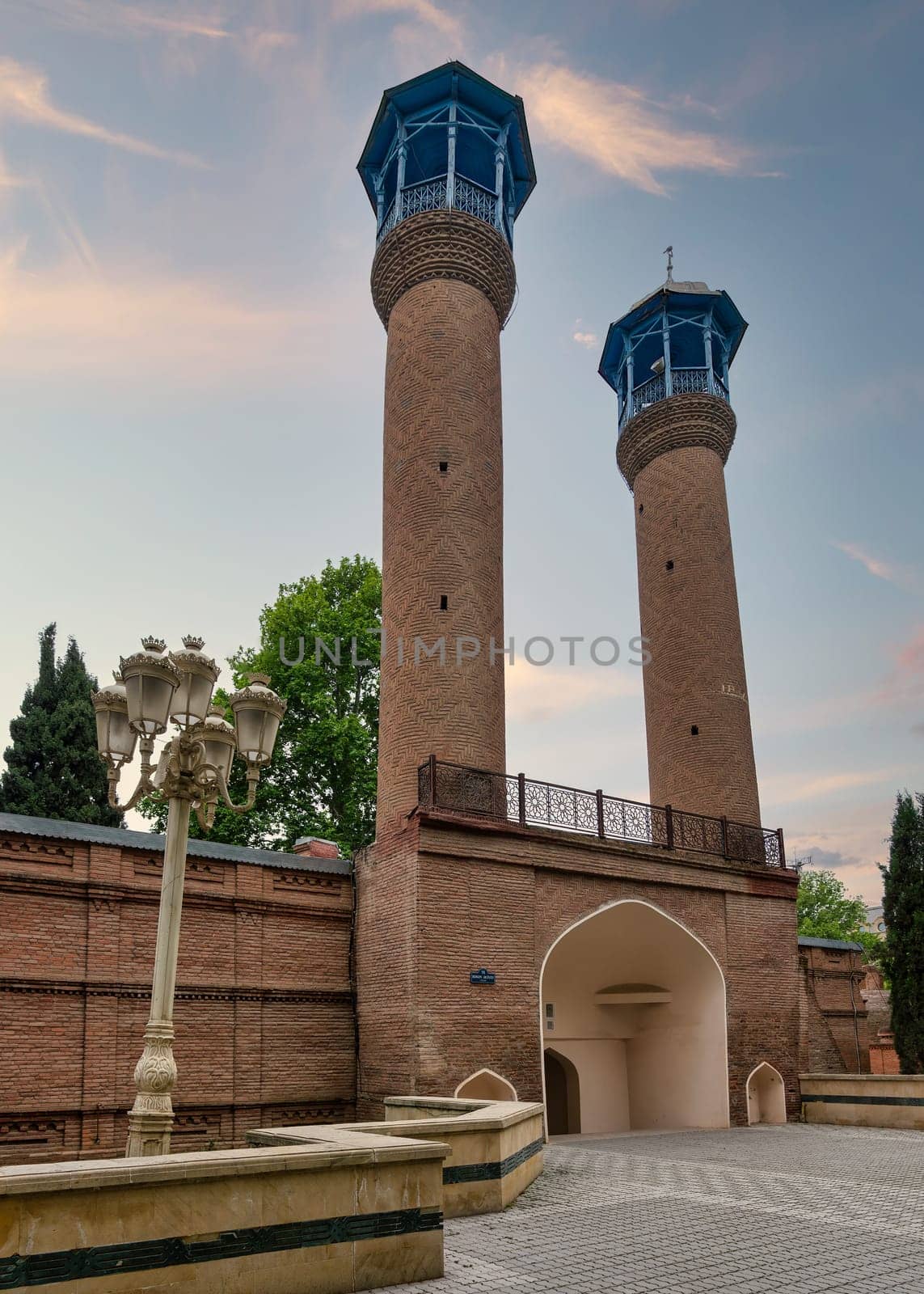 A view of the Juma Mosque of Ganja, Azerbaijan, with its two tall minarets and red bricks facade