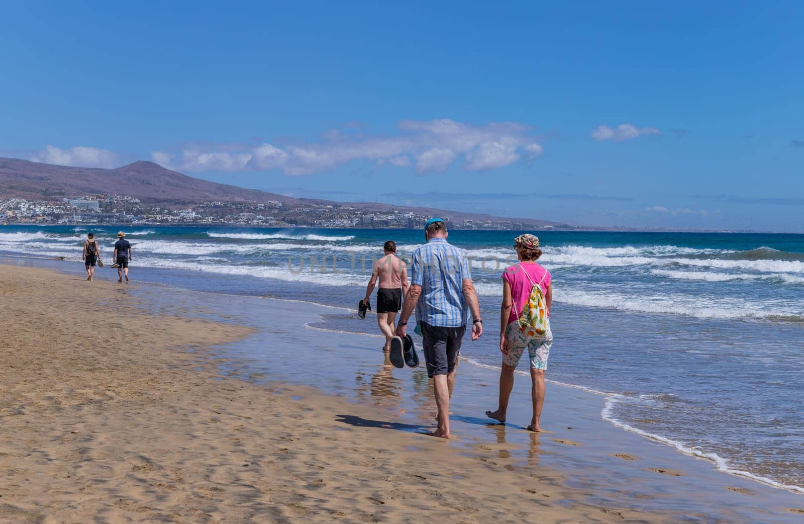Gran Canaria, Spain - March 20, 2024: People visit Playa Ingles beach in Maspalomas, Gran Canaria. Spain