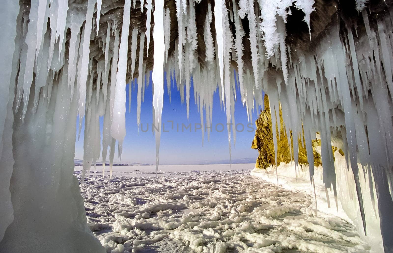 Winter on the Baikal, ice and snow on the lake. The beauty of the nature of Baikal in winter.
