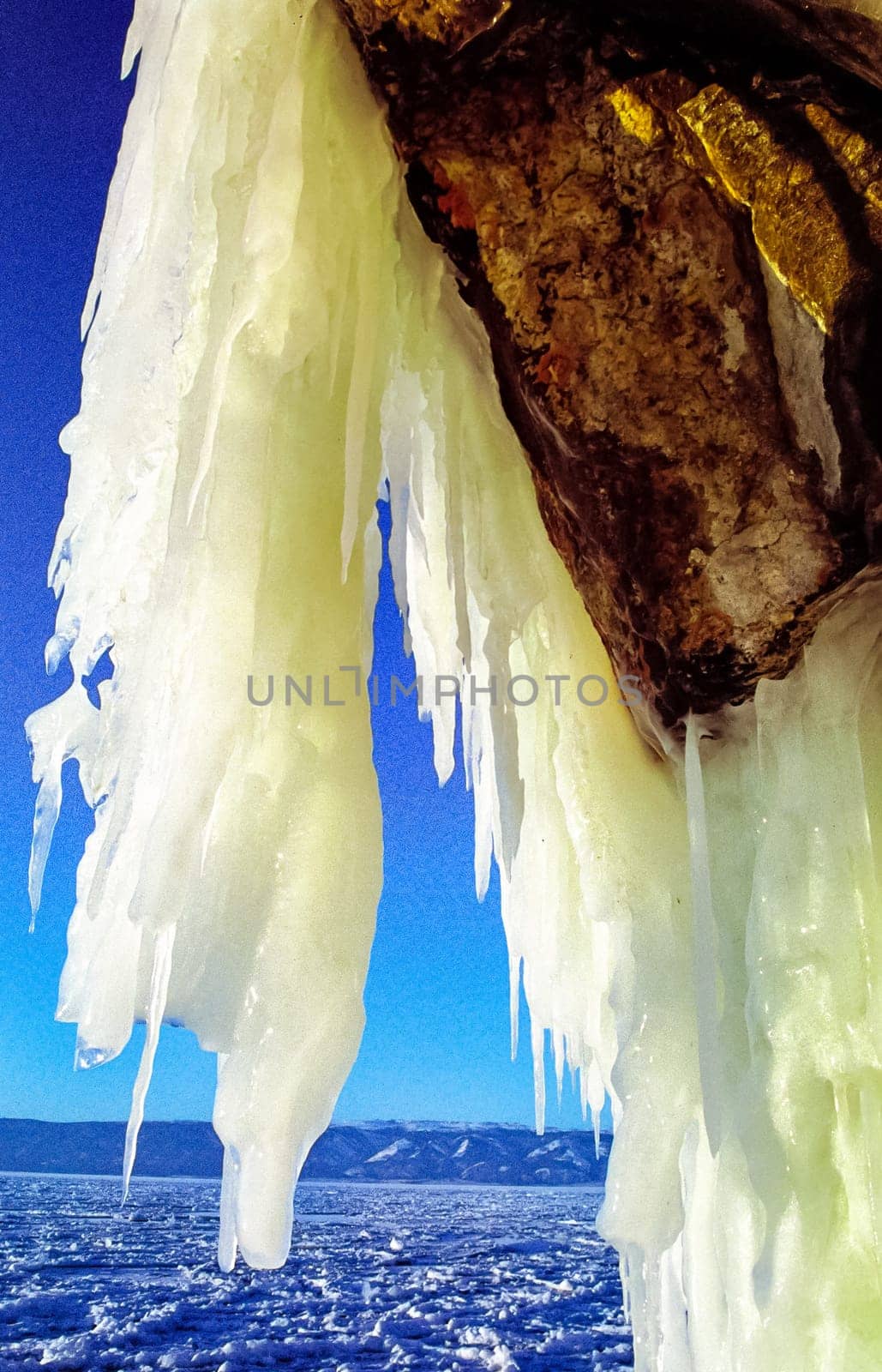 Winter on the Baikal, ice and snow on the lake. The beauty of the nature of Baikal in winter.