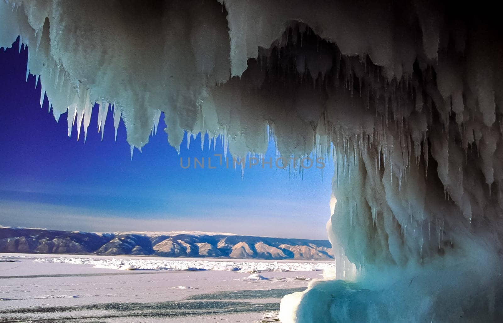 Winter on the Baikal, ice and snow on the lake. The beauty of the nature of Baikal in winter.