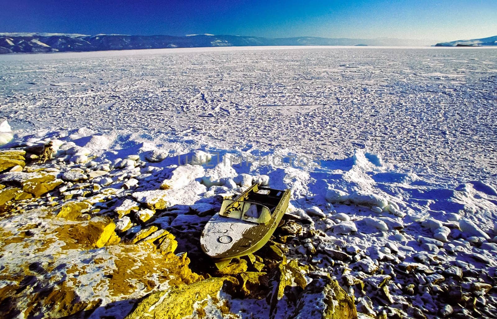 Winter on the Baikal, ice and snow on the lake. The beauty of the nature of Baikal in winter.
