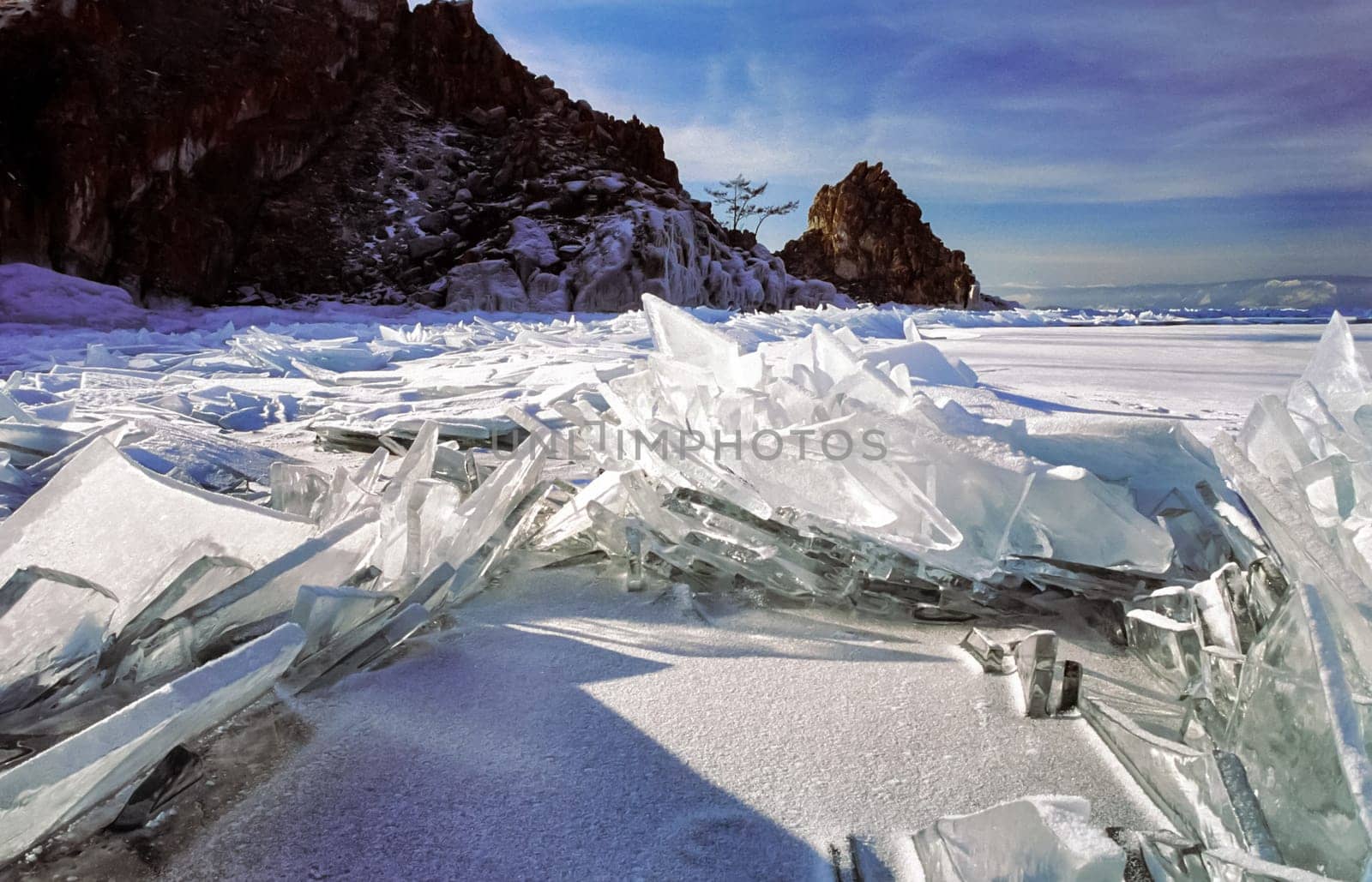 Winter on the Baikal, ice and snow on the lake. The beauty of the nature of Baikal in winter.