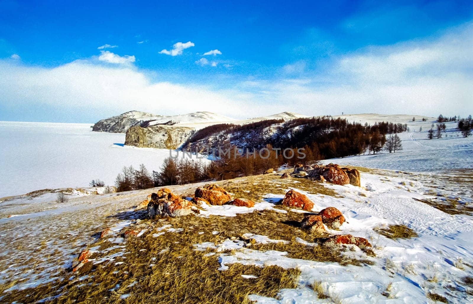 Winter on the Baikal, ice and snow on the lake. The beauty of the nature of Baikal in winter.