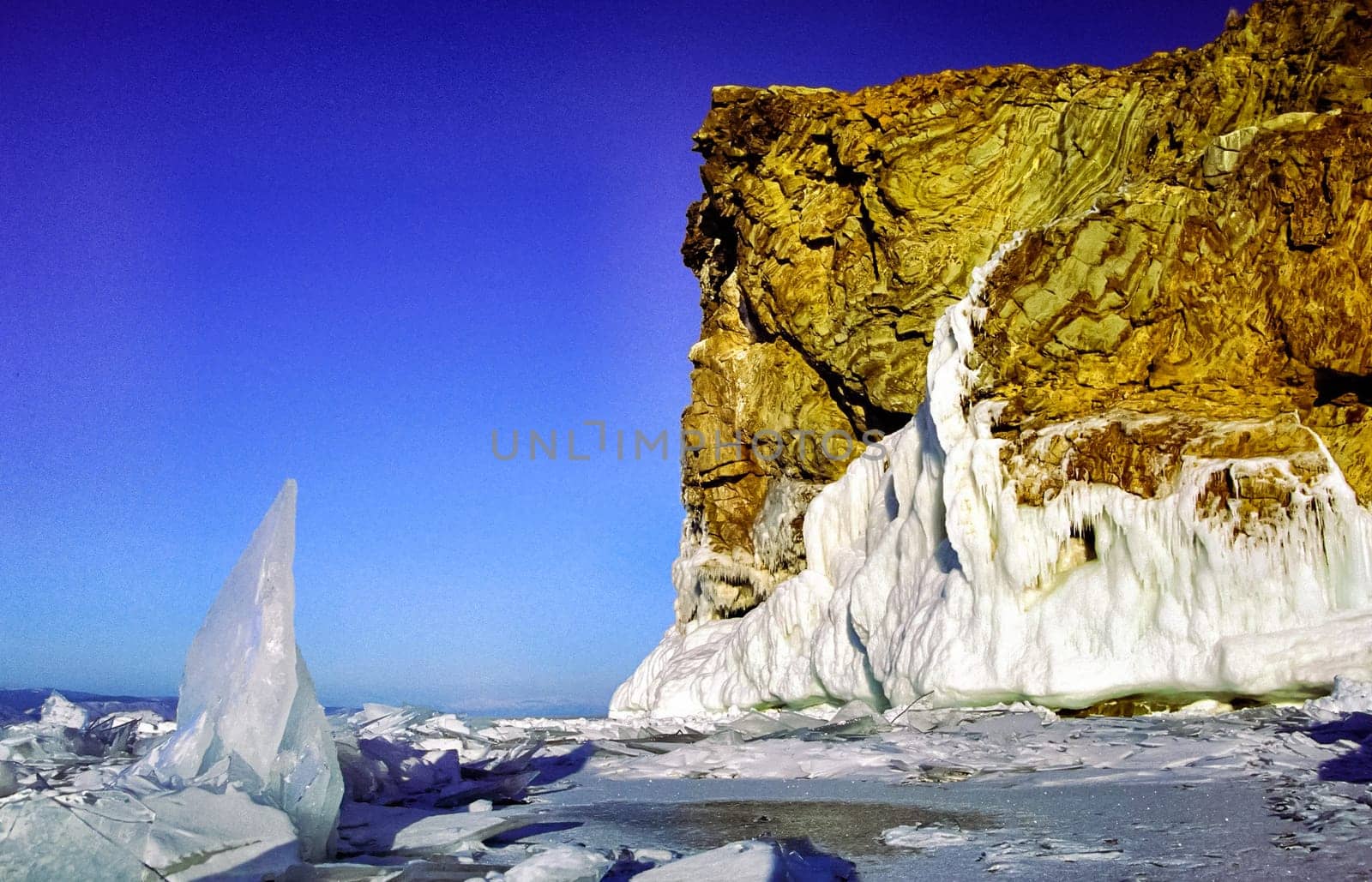 Winter on the Baikal, ice and snow on the lake. The beauty of the nature of Baikal in winter.