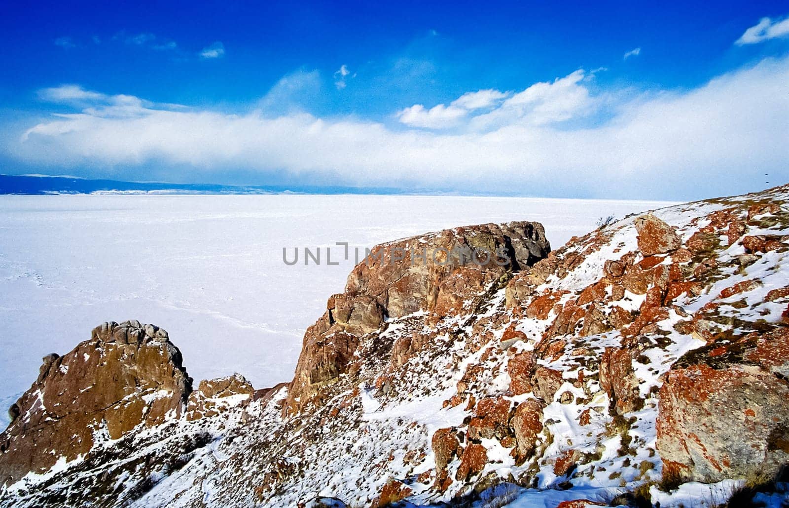 Winter on the Baikal, ice and snow on the lake. The beauty of the nature of Baikal in winter.