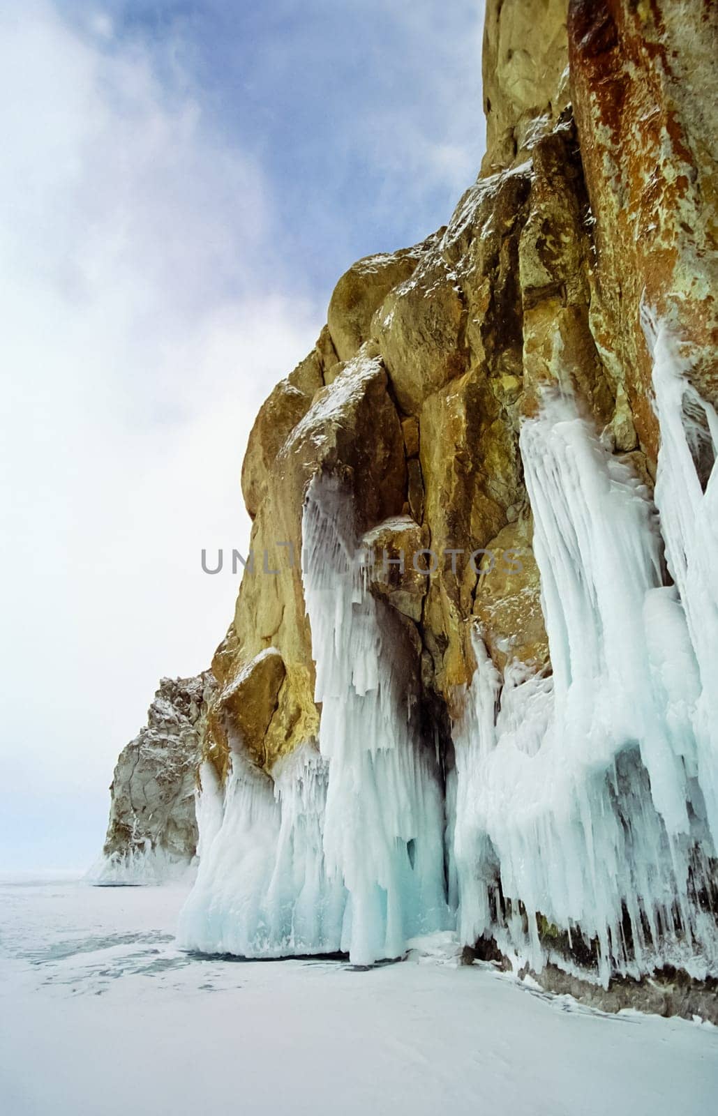 Winter on the Baikal, ice and snow on the lake. The beauty of the nature of Baikal in winter.