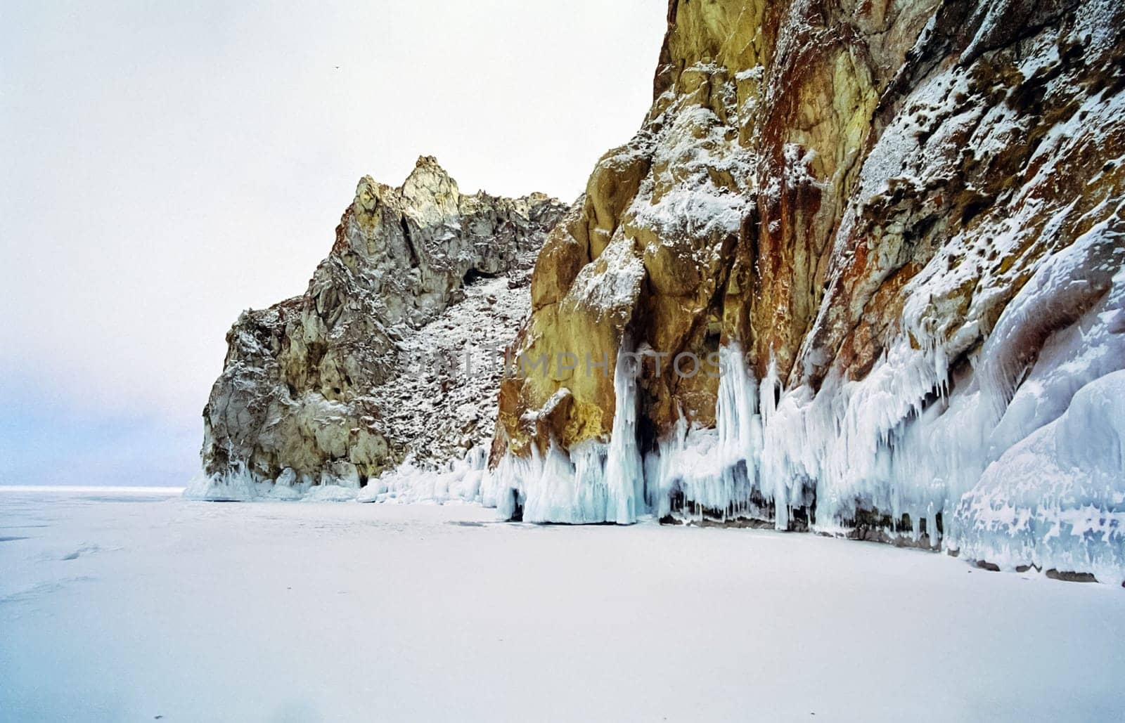Winter on the Baikal, ice and snow on the lake. The beauty of the nature of Baikal in winter.