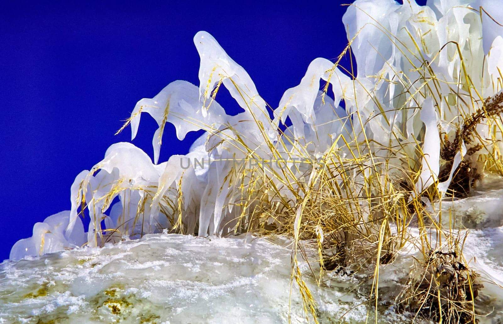 Winter on the Baikal, ice and snow on the lake. The beauty of the nature of Baikal in winter.